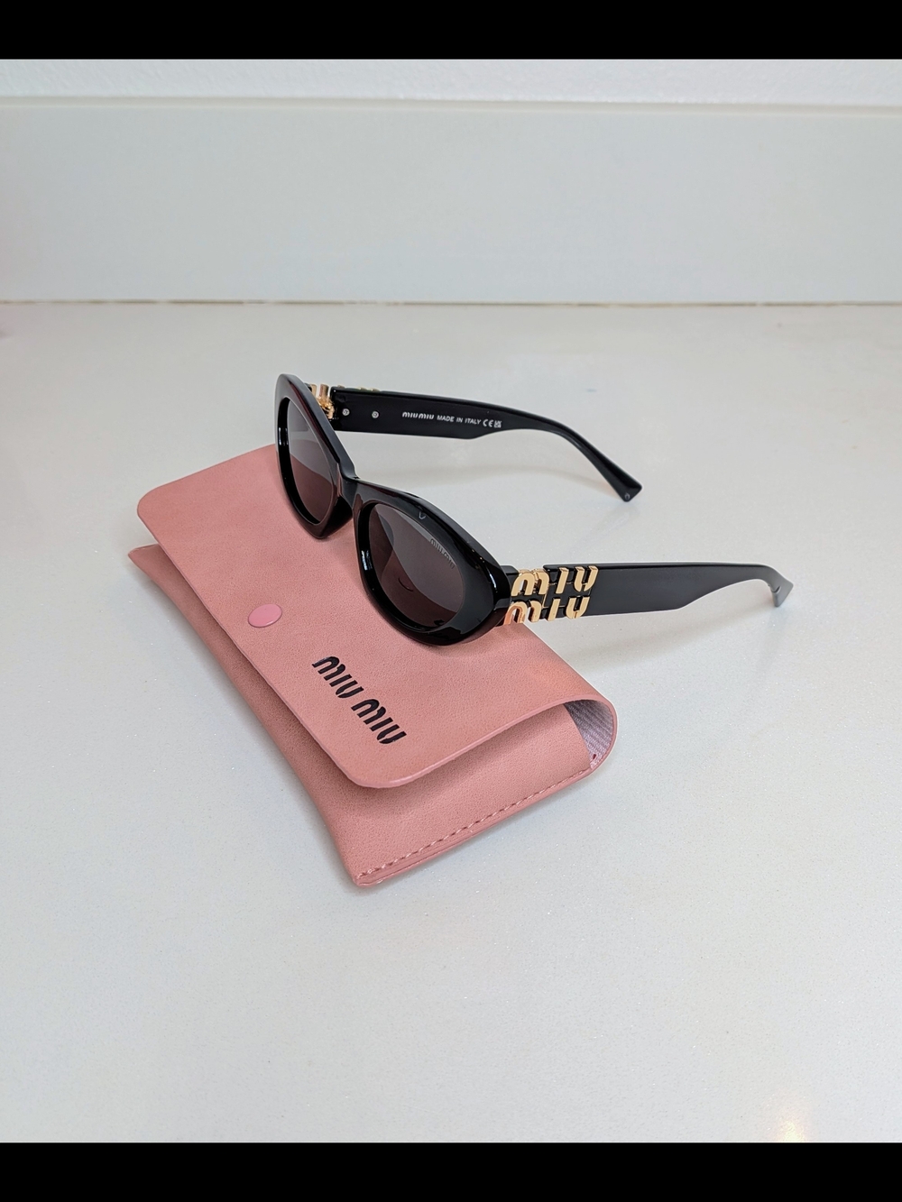 Miu Miu Women's Black Oval Cat Eye Sunglasses - Picture 9 of 13